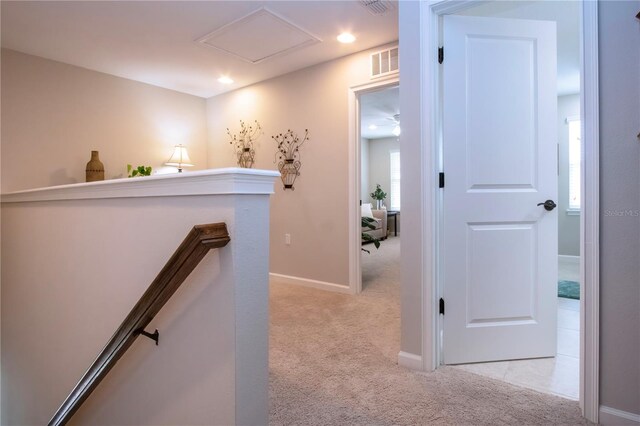 11728 Meadowgate Pl, Bradenton, FL 34211 - hall with an upstairs landing, light colored carpet, baseboards, healthy amount of natural light, and recessed lighting
