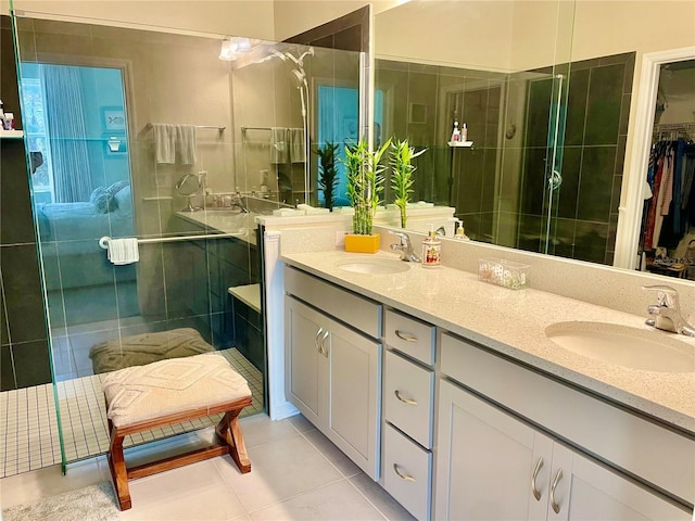 bathroom featuring vanity, tile patterned floors, and walk in shower