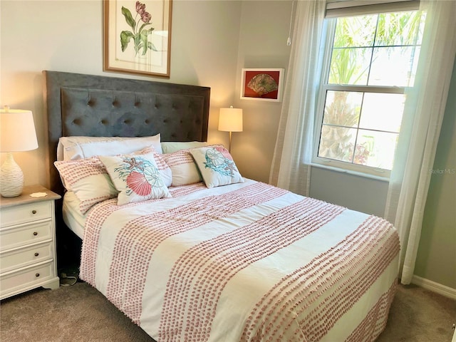 bedroom featuring dark colored carpet