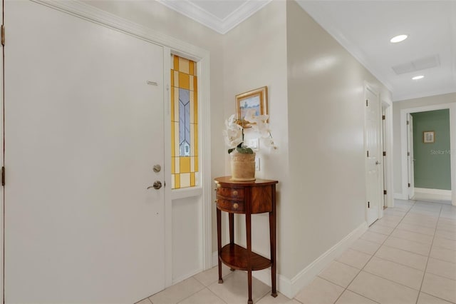 tiled foyer entrance with ornamental molding