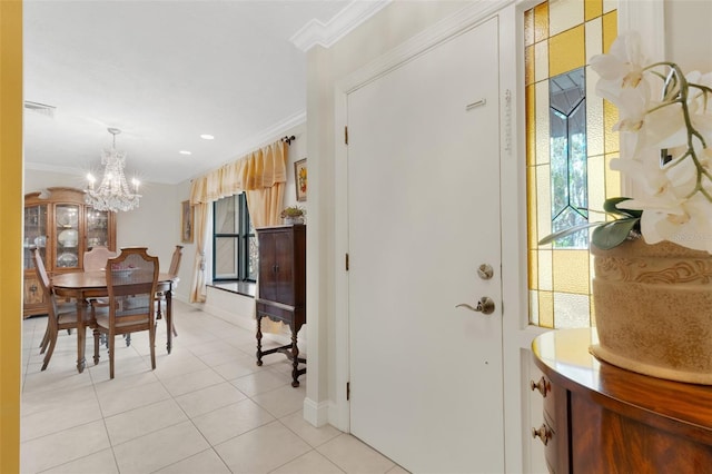 interior space featuring ornamental molding, light tile patterned flooring, and an inviting chandelier