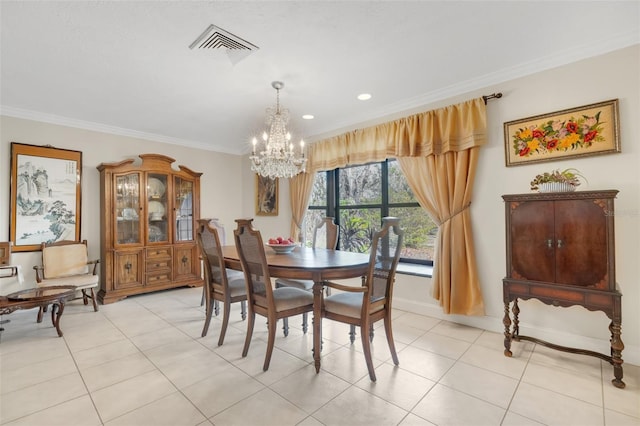 dining space featuring light tile patterned floors, crown molding, and a chandelier