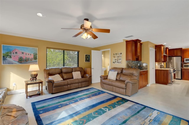 living room with ornamental molding and ceiling fan