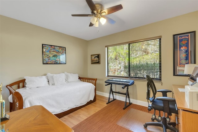 bedroom featuring hardwood / wood-style flooring and ceiling fan