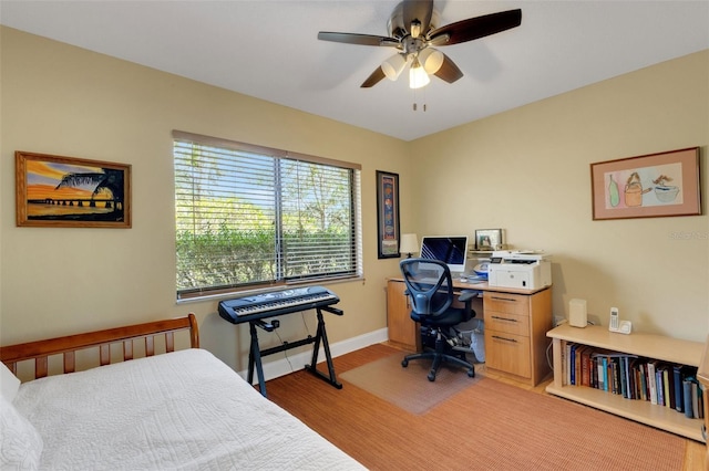 bedroom with ceiling fan and light hardwood / wood-style flooring