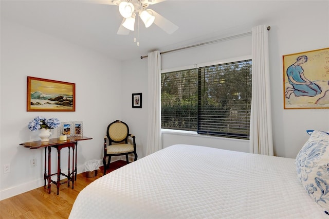 bedroom featuring wood-type flooring and ceiling fan