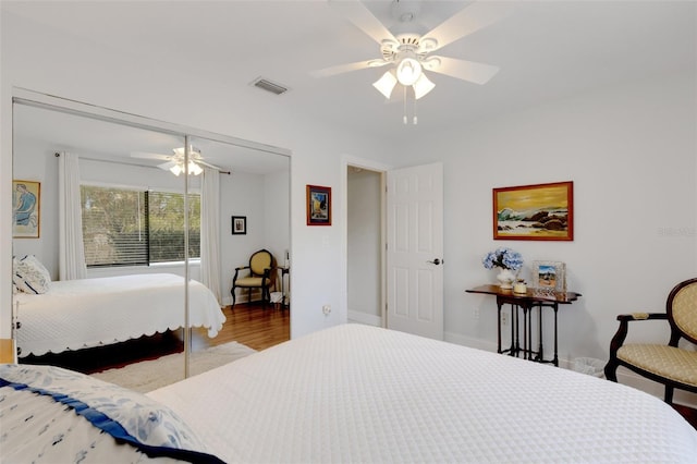 bedroom with hardwood / wood-style flooring and ceiling fan