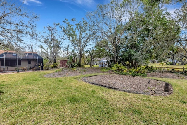 view of yard with a lanai