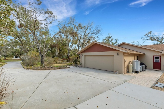 view of side of property with a garage