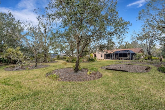 view of yard featuring glass enclosure