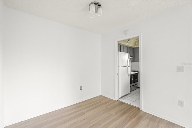 unfurnished room featuring light hardwood / wood-style flooring