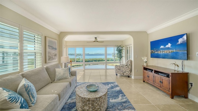 tiled living room with crown molding and ceiling fan