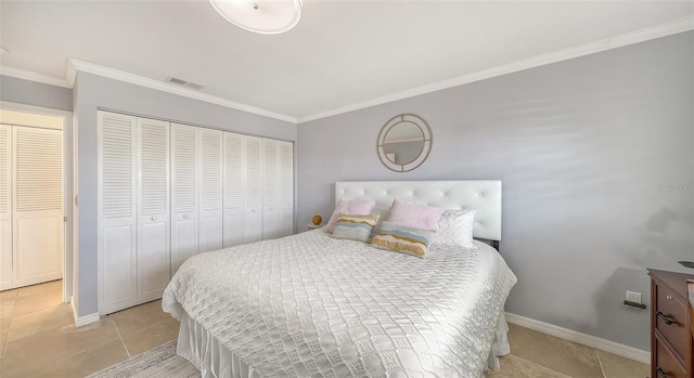 tiled bedroom with crown molding and a closet