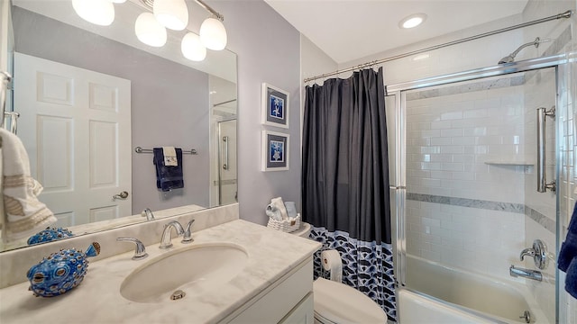 full bathroom featuring vanity, shower / tub combo, and toilet