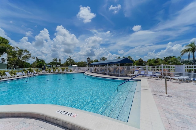 view of swimming pool with a patio area