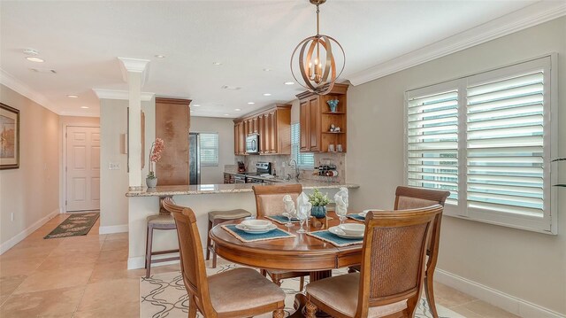 dining area with light tile patterned floors, a chandelier, recessed lighting, baseboards, and crown molding