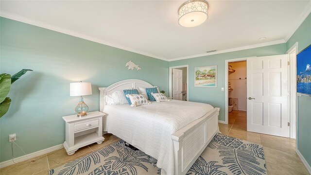 bedroom with ornamental molding, light tile patterned flooring, visible vents, and baseboards