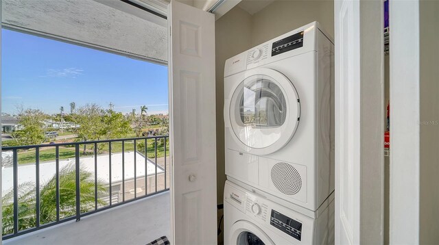 washroom with laundry area and stacked washer and clothes dryer