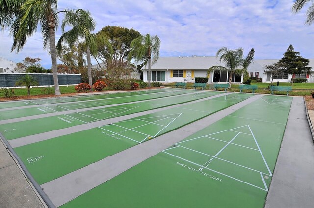 view of property's community featuring shuffleboard