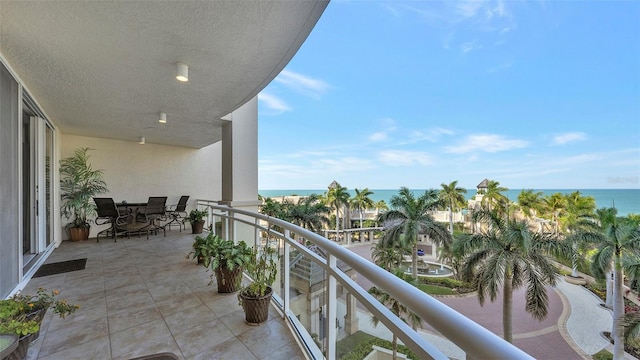 balcony featuring a water view