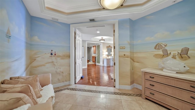 bathroom with tile patterned floors and a raised ceiling