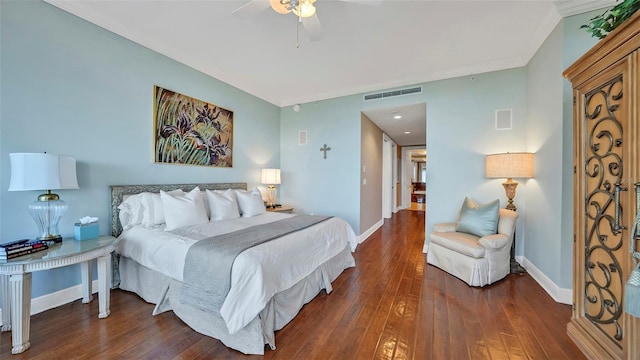 bedroom featuring ceiling fan and dark hardwood / wood-style floors