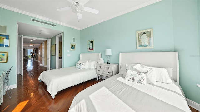 bedroom with ceiling fan, dark wood-type flooring, and crown molding