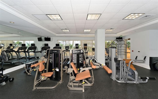 workout area featuring a raised ceiling