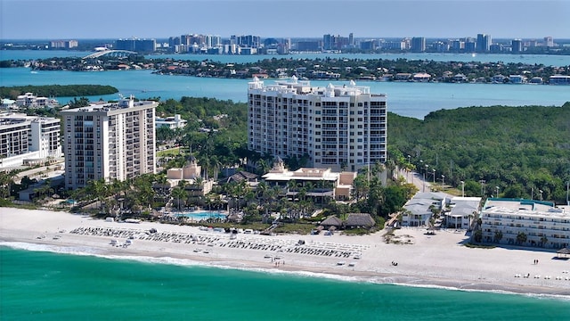 bird's eye view with a water view and a view of the beach