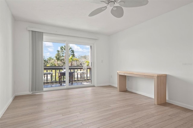 unfurnished room featuring light wood finished floors, a ceiling fan, and baseboards