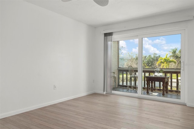 unfurnished room featuring a healthy amount of sunlight, light wood finished floors, baseboards, and a ceiling fan