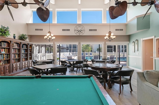 game room featuring visible vents and a notable chandelier