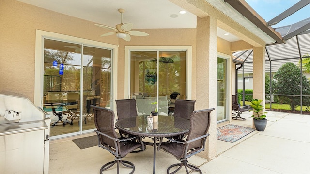 7244 Orchid Island Pl, Bradenton, FL 34202 - sunroom / solarium featuring a ceiling fan and outdoor dining space