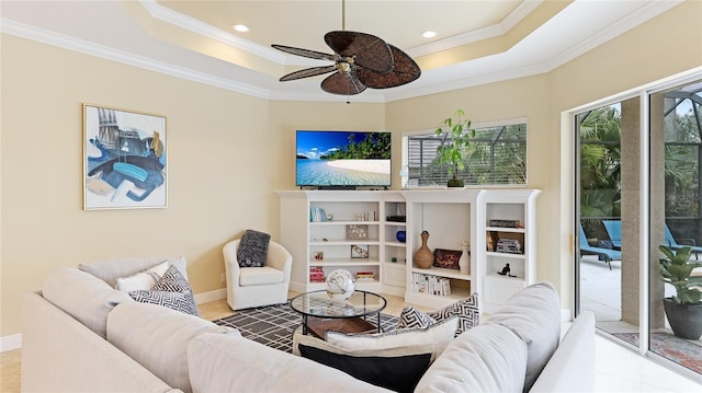 7244 Orchid Island Pl, Bradenton, FL 34202 - tiled living room with crown molding, a raised ceiling, a ceiling fan, and recessed lighting