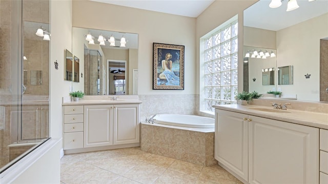 7244 Orchid Island Pl, Bradenton, FL 34202 - full bathroom featuring two vanities, a bath, tile patterned floors, and a tile shower