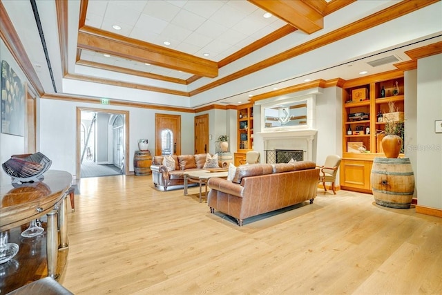7244 Orchid Island Pl, Bradenton, FL 34202 - living area with crown molding, light wood-style floors, and a fireplace