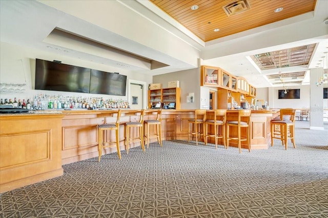 7244 Orchid Island Pl, Bradenton, FL 34202 - community bar area with a raised ceiling, carpet, and wooden ceiling