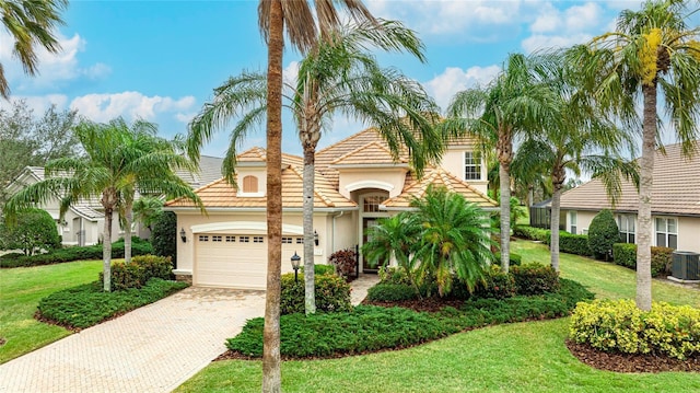 7244 Orchid Island Pl, Bradenton, FL 34202 - view of front of house featuring stucco siding, decorative driveway, a garage, and a front lawn