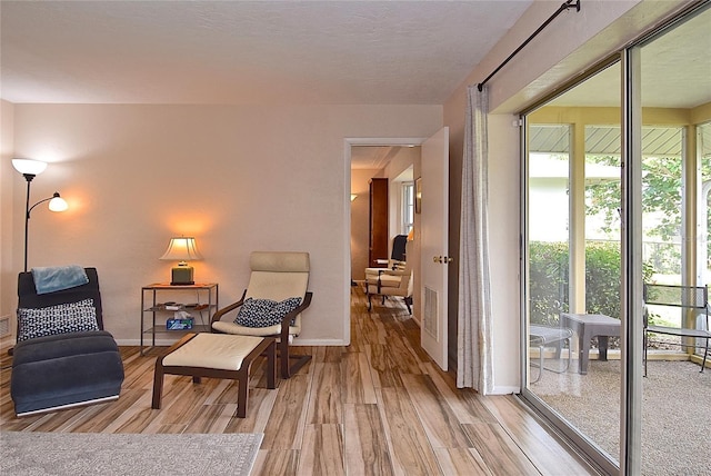 living area with light hardwood / wood-style floors