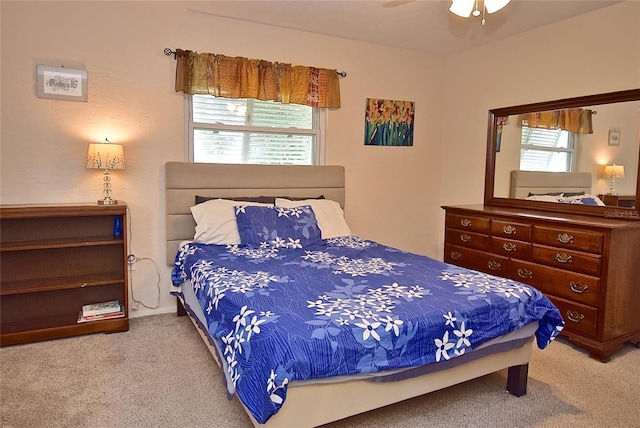 bedroom with ceiling fan and carpet