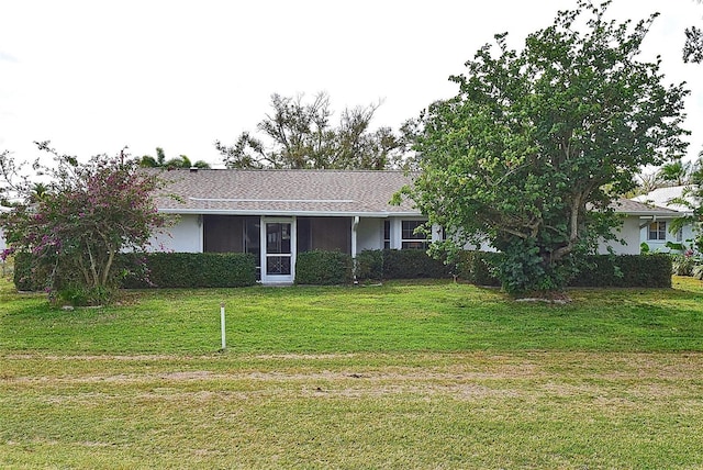 ranch-style house featuring a front lawn