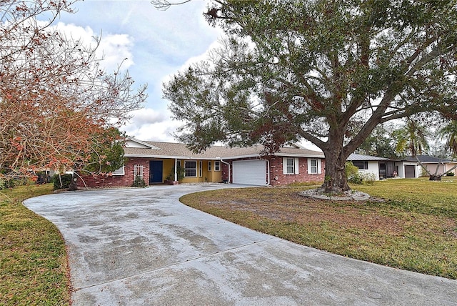 ranch-style home featuring a garage and a front yard