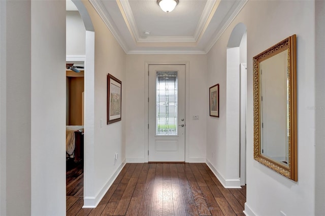 entryway featuring ornamental molding and dark hardwood / wood-style floors