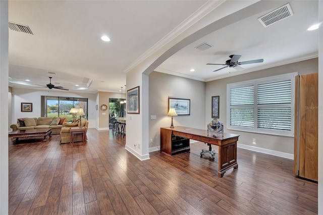 office space featuring crown molding, dark hardwood / wood-style floors, and ceiling fan