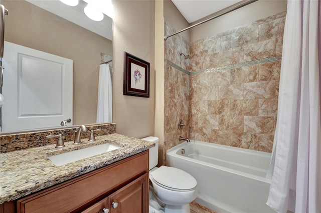 full bathroom with vanity, shower / tub combo, and toilet