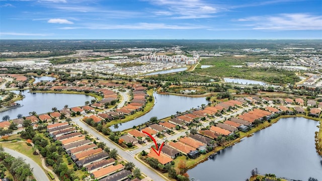 birds eye view of property featuring a water view