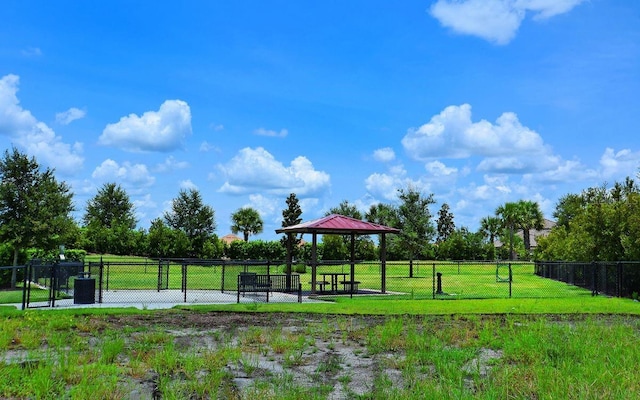 view of home's community with a gazebo and a lawn