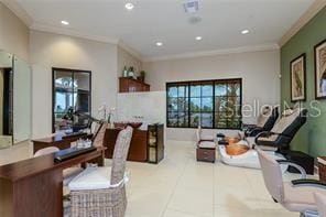 living room with crown molding and light tile patterned floors