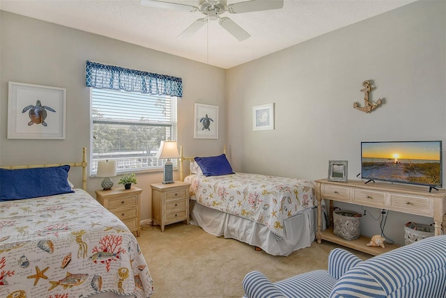 bedroom with light carpet, a textured ceiling, and ceiling fan