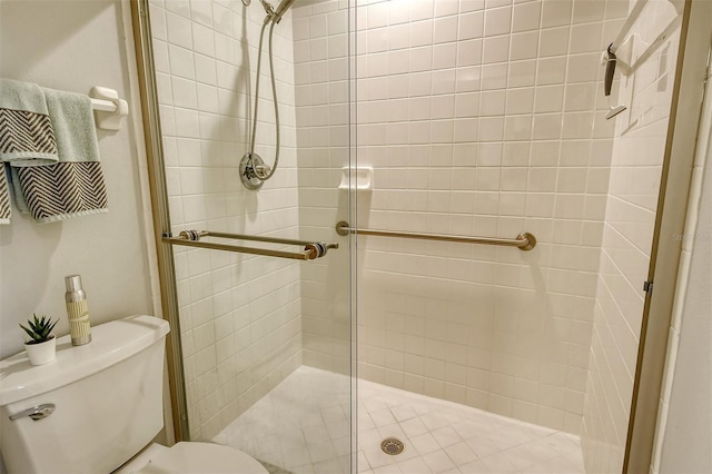 bathroom featuring walk in shower and toilet